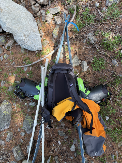 Skis strapped to a backpack in A-frame style