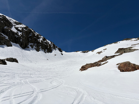A slope with ski tracks